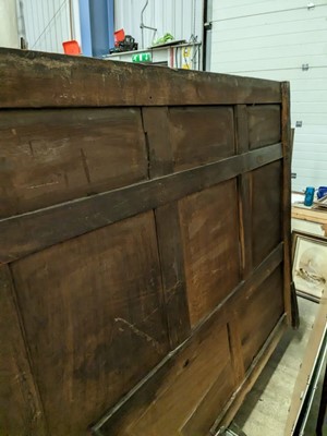 Lot 1104 - A North Country joined and carved oak box settle.