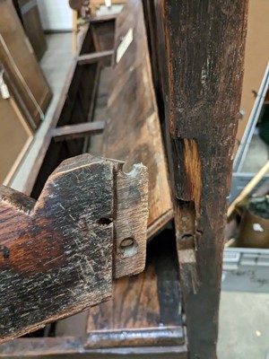 Lot 1104 - A North Country joined and carved oak box settle.