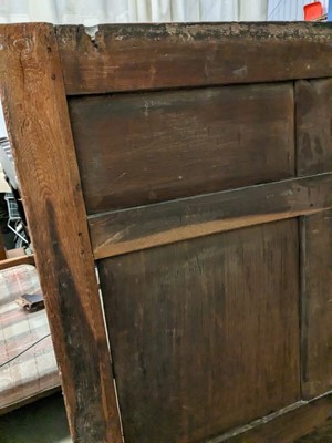 Lot 1104 - A North Country joined and carved oak box settle.