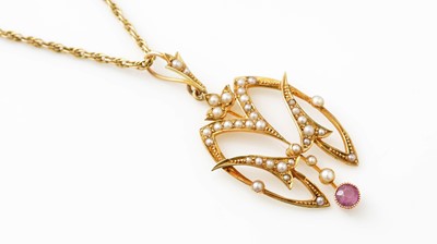 Lot 413 - An Edwardian seed pearl and pink sapphire pendant