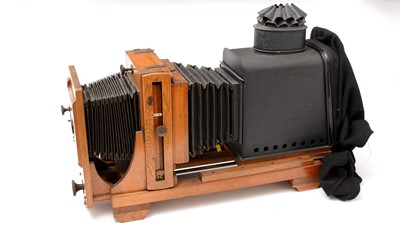 Lot 1 - An Edwardian Thornton Pickard folding Magic Lantern with slides