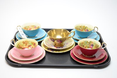 Lot 399 - A harlequin set of five Aynsley fruit decorated tea trios