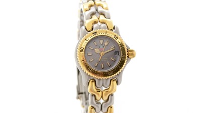 Lot 574 - Tag Heuer Professional: a steel and gilt metal-cased quartz wristwatch