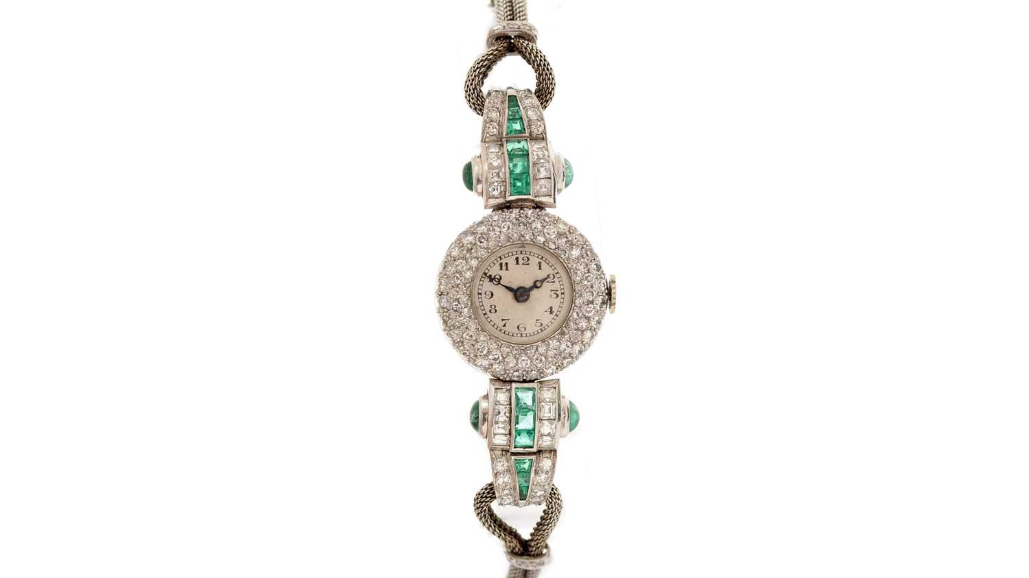 Lot 606 - An Art Deco emerald and diamond cocktail watch