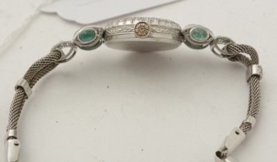 Lot 606 - An Art Deco emerald and diamond cocktail watch