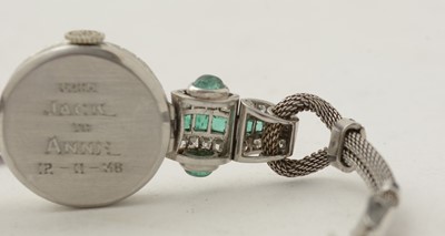 Lot 606 - An Art Deco emerald and diamond cocktail watch