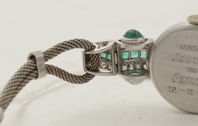 Lot 606 - An Art Deco emerald and diamond cocktail watch