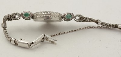 Lot 606 - An Art Deco emerald and diamond cocktail watch