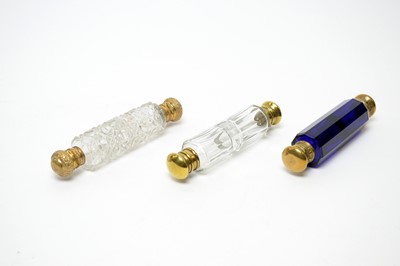 Lot 145 - Three Victorian cut glass double-ended scent bottles