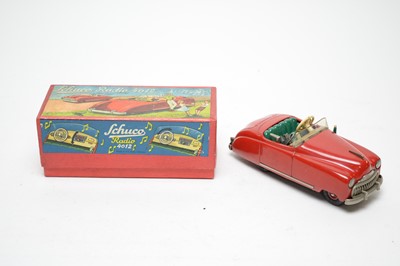 Lot 405 - A Schuco Radio 4012, formed as a musical red tin plate clockwork car.
