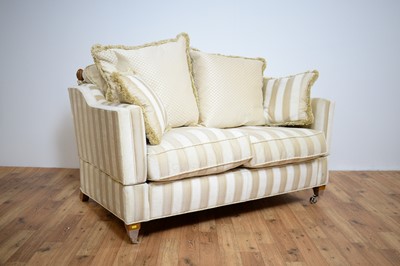 Lot 81 - Gascoigne Designs: A contemporary luxury two-seater drop-arm sofa.