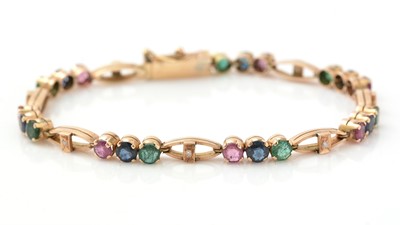 Lot 446 - A 14ct yellow gold and gem set bracelet