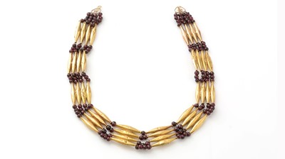 Lot 700 - An Egyptian yellow gold and garnet necklace