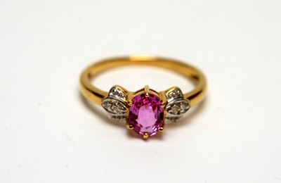 Lot 218 - A pink sapphire and diamond ring