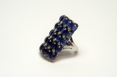 Lot 220 - A sapphire cabochon and diamond dress ring