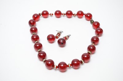 Lot 19 - A 1930s Art Deco cherry-red lucite demi-parure