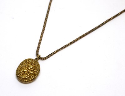 Lot 146 - An 18ct yellow gold mounted Indian locket pendant