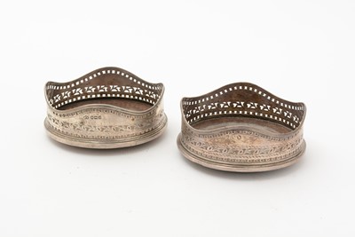 Lot 93 - George III Irish silver wine coaster; and an Edwardian silver wine coaster