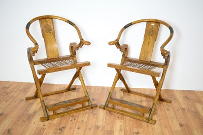 Lot 3 - A pair of Chinese hardwood and metal mounted folding hunting chairs