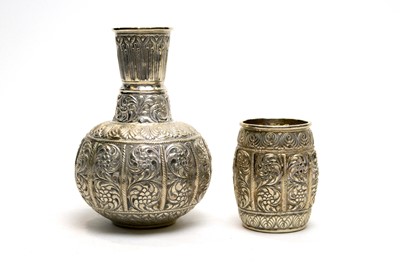 Lot 112 - An Indian white metal ewer and beaker