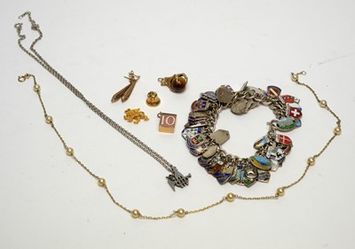 Lot 148 - A silver charmed bracelet; and other items