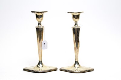Lot 132 - A pair of silver candlesticks