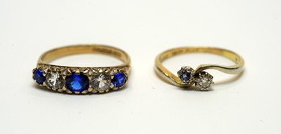 Lot 211 - A sapphire and diamond ring and another