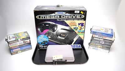 Lot 322 - A Sega Mega Drive computer game console; together with a selection of games; and a Nintendo Gameboy