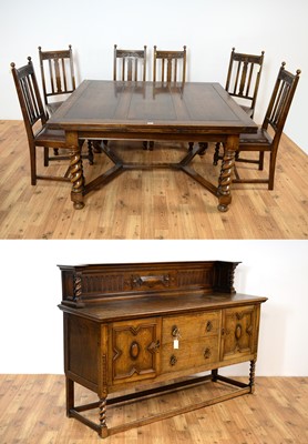 Lot 69 - A 20th Century Jacobean revival oak dining suite