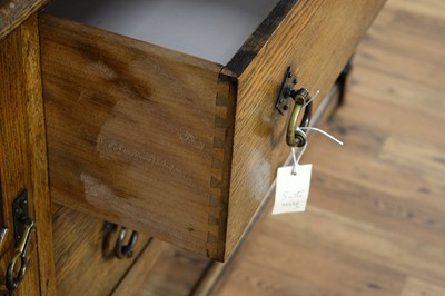 Lot 69 - A 20th Century Jacobean revival oak dining suite
