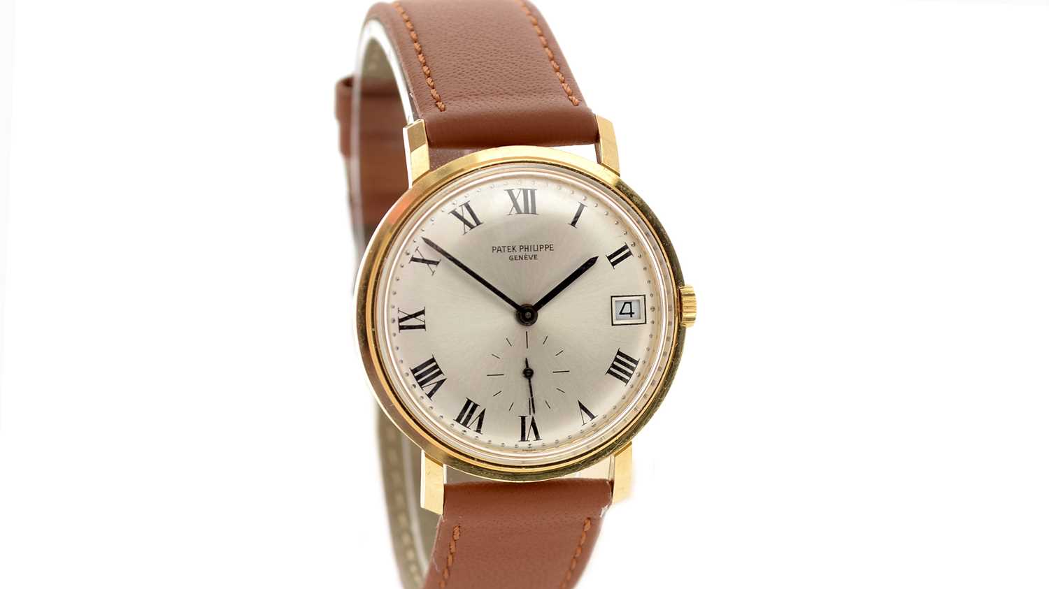 Lot 613 - Patek Philippe, Geneve: an 18ct yellow gold-cased automatic wristwatch