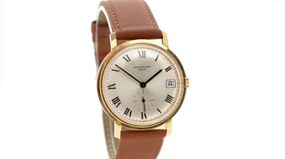 Lot 613 - Patek Philippe, Geneve: an 18ct yellow gold-cased automatic wristwatch