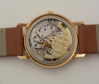 Lot 613 - Patek Philippe, Geneve: an 18ct yellow gold-cased automatic wristwatch
