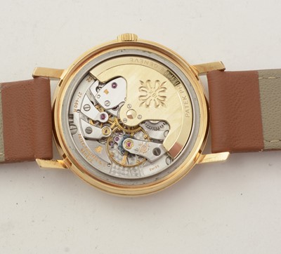 Lot 613 - Patek Philippe, Geneve: an 18ct yellow gold-cased automatic wristwatch