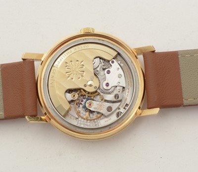 Lot 613 - Patek Philippe, Geneve: an 18ct yellow gold-cased automatic wristwatch