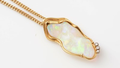 Lot 425 - An opal and diamond pendant