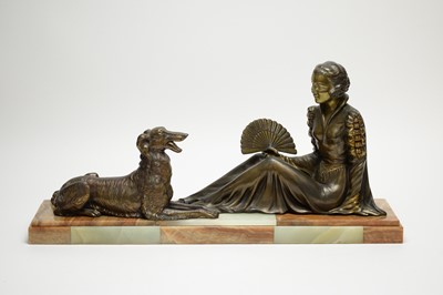 Lot 264 - A bronzed Art Deco figure group of a lady