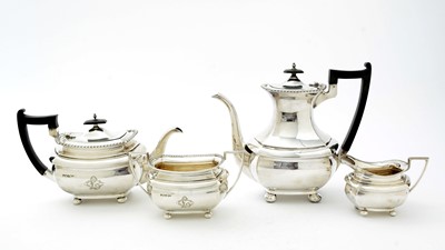Lot 52 - An Edwardian three piece silver tea set and matching coffee pot