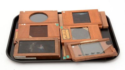 Lot 27 - A collection of 15 early 20th Century handpainted mahogany framed lantern slides