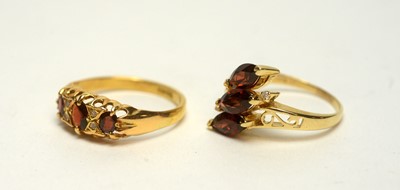 Lot 136 - Two garnet and diamond rings