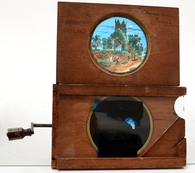Lot 36 - A collection of six Victorian mahogany springed mechanical lantern slide