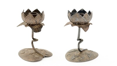 Lot 119 - A pair of early 20th century Indian silver candlesticks