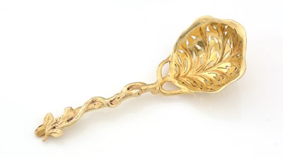 Lot 151 - A Victorian silver gilt, naturalistic sugar sifter ladle