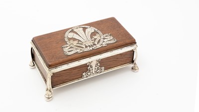 Lot 347 - An Edwardian/George V arts and crafts silver mounted oak cigarette casket