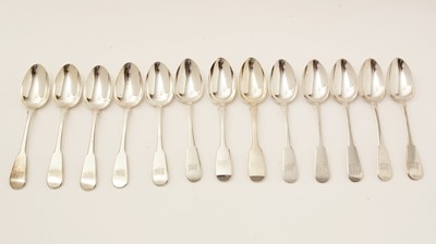 Lot 144 - A set of 11 George IV Scottish silver dessert spoons; and two Newcastle made dessert spoons