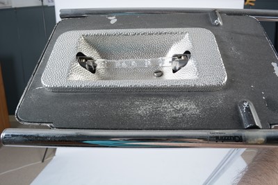 Lot 55 - After Harvey Guzzini: A mid-Century chrome and glass uplighter standard lamp