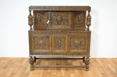 Lot 40 - A mid 20th century Jacobean Revival carved oak buffet