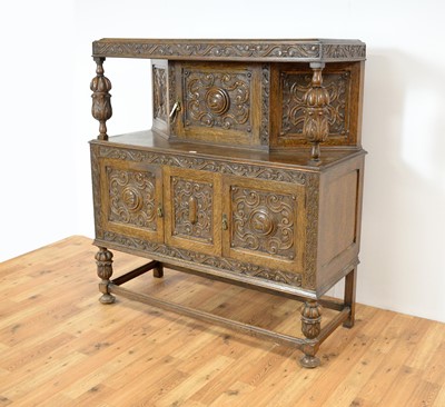 Lot 40 - A mid 20th century Jacobean Revival carved oak buffet