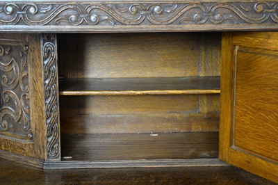 Lot 40 - A mid 20th century Jacobean Revival carved oak buffet