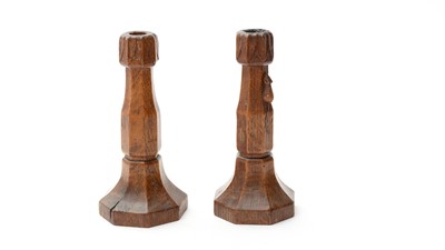 Lot 1292 - Robert Mouseman Thompson of Kilburn, a pair of carved oak candlesticks